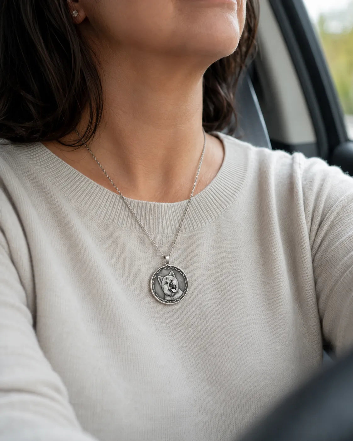 A coin worn on a chain